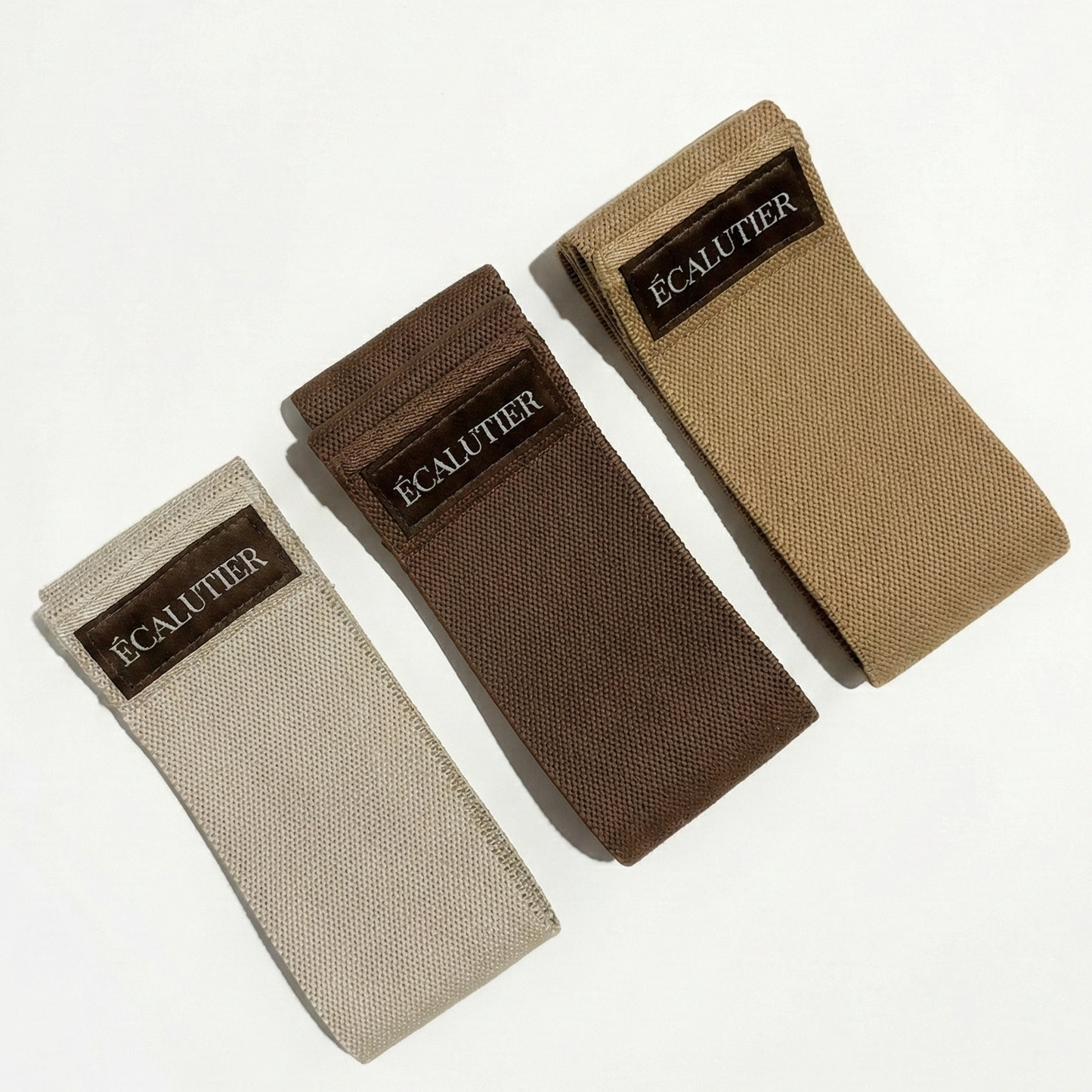 Pilates Widerstandsbänder Set mit drei Stoffbändern in Beige und Braun