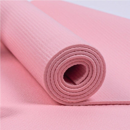Gerollte rosa Yogamatte aus dem Myga Yoga-Set. Strukturierte Oberfläche für rutschfesten Halt.